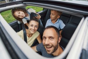 Moonroof vs Sunroof-Family-Of-Four-Feeling-Excited
