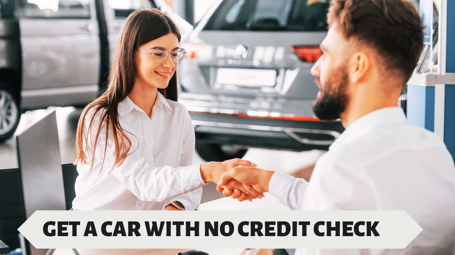 Smiling lady shaking hands with a car dealer