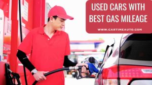 gas station employee filling car gas